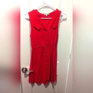 Red summer dress.  Bold color and buttons up the front.